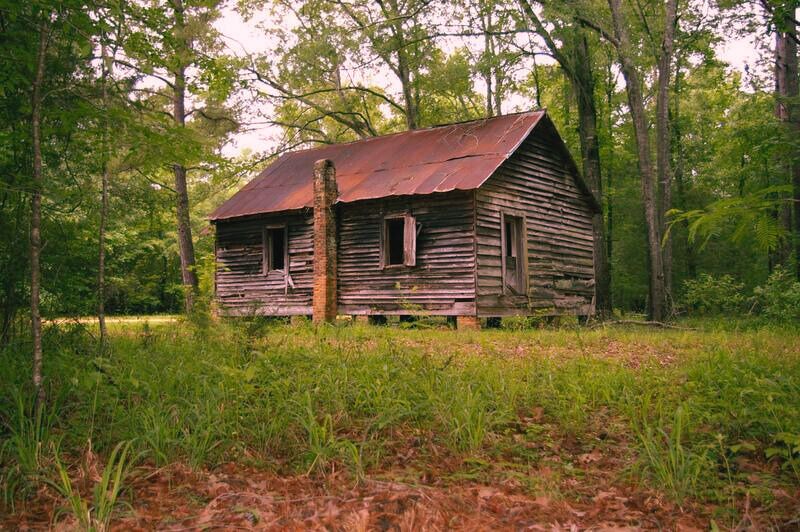 Old Cahawaba, a historic ghost town in Orrville, Alabama, with abandoned buildings and overgrown pathways. 