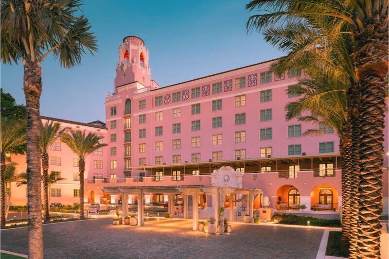 The Vinoy Resort, a pink hotel with palm trees, combines its glamorous history with contemporary luxury, one of the most haunted places in Florida.