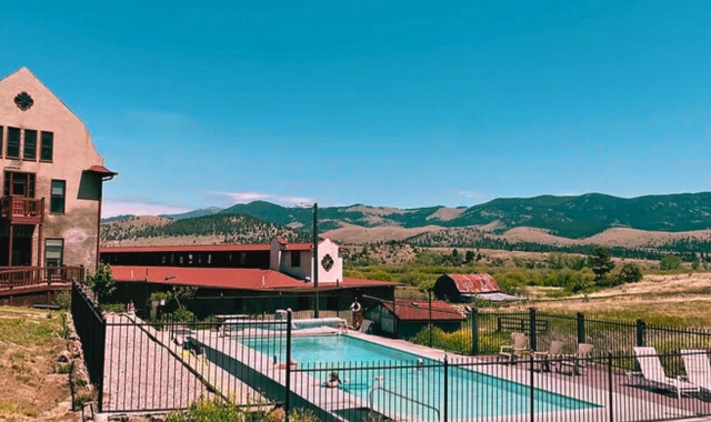 The Boulder Hot Springs Hotel, with its tranquil pool and stunning mountain views, is one of the most haunted places in Montana.