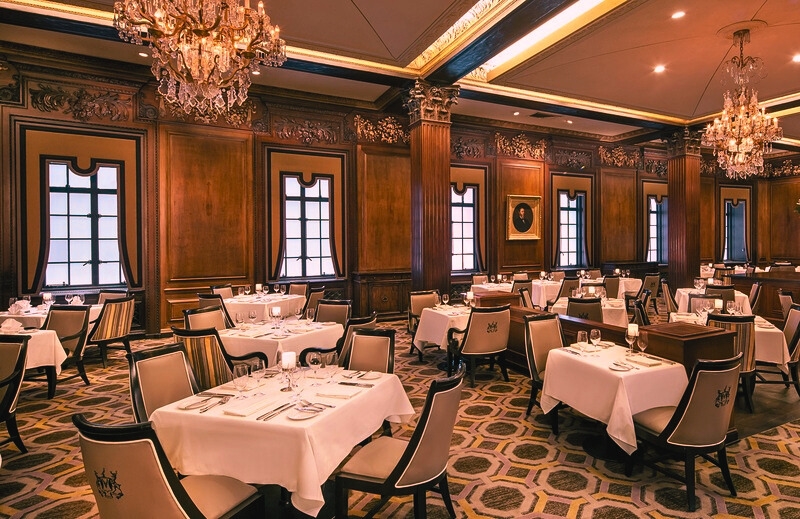 Elegant dining room at the Omni Parker House Hotel, showcasing historic charm and old-world sophistication in Boston.