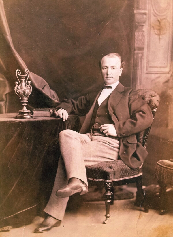 Vintage image of James Hornibrook, seated in a chair, the main haunting at the Empress of Little Rock.