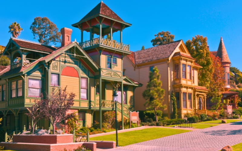 A row of vibrant Victorian houses in Old Town San Diego, showcasing colorful facades in a charming residential neighborhood.