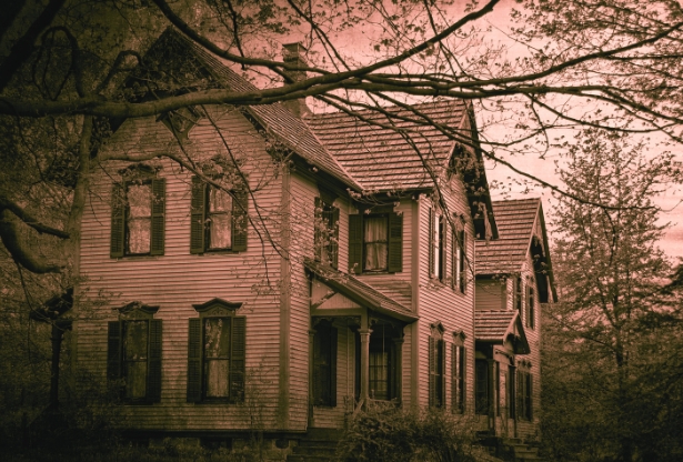 A vintage house set against a striking red sky, creating a captivating and atmospheric scene.