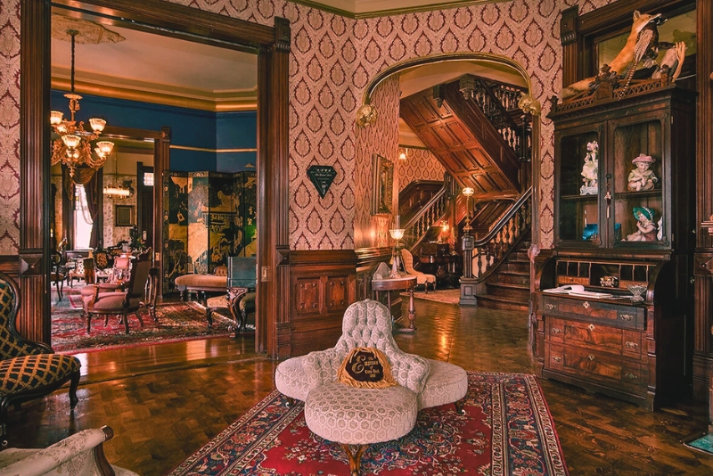 The haunted Empress of Little Rock in Arkansas, a stunning Victorian mansion, featuring ornate hallways and historic charm.
