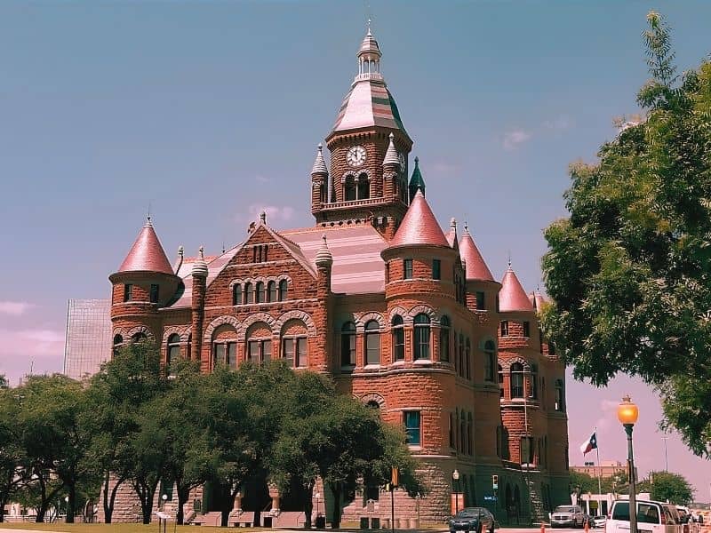 The Old Red Museum, a large brick building with a clock tower, is located in Dallas, Texas, and is considered one of the most haunted sites.